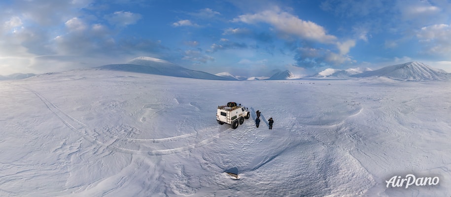 All-terrain vehicle on the frozen river All-terrain vehicle on the frozen river